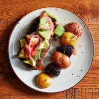 Grilled Skirt Steak · Topped with Avocado, Tomato, & Red Onion Salad, Roasted Rosemary Potato Medley