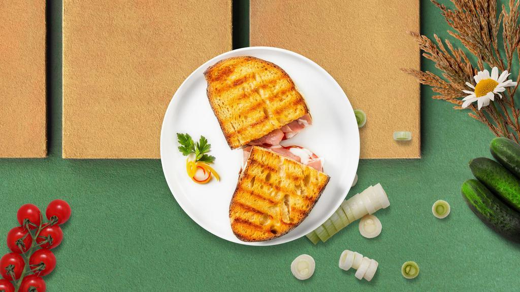 The Fowl Panini · Sliced turkey, melted cheese, and tomato on your choice of toasted bread.