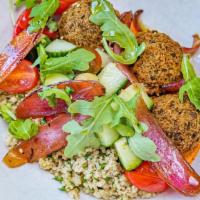 Falafel Bowl · walnut romesco, quinoa tabouli, israeli salad, marinated onion