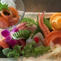 Sashimi Deluxe · Eighteen pieces of assorted raw fish.