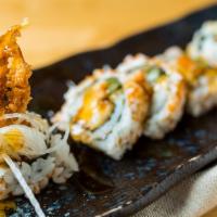 Spider Roll · Gently fried soft shell crab wrapped in cucumber, avocado scallion and masago.