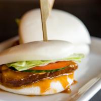 Pork Bun (2) · Slow roasted pork with lettuce, tomato, cucumber, and Japanese spicy mayo on a soft or crisp...