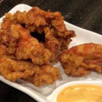 Karaage Chicken · Lightly battered boneless chicken marinated with fresh ginger juice served with Japanese spi...