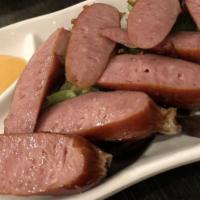 Japanese Sausage · Natural heritage Berkshire pork sausage, pan-fried, and served with Japanese spicy mayo.