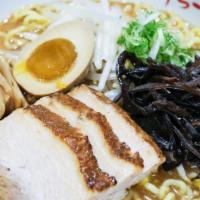 Miso · Pork and chicken broth with miso paste and wavy egg noodle topped with roast pork, bamboo sh...
