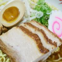 Pork Shoyu · Light soy sauce and chicken broth with wavy egg noodle topped with roast pork (charshu), bam...