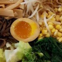 Veggie Shoyu Ramen · Shoyu vegetable broth with wavy egg noodle topped with cabbage, carrot, seasonal veggie, bam...