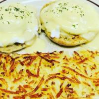 Breakfast Deluxe 2 · Classic eggs Benedict. 2 poached eggs with Canadian bacon on a toasted English muffin, toppe...