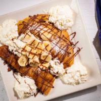 Lovers Delight Crepes · Nutella & Banana Filled Crepes, Whipped Cream, Powdered Sugar.