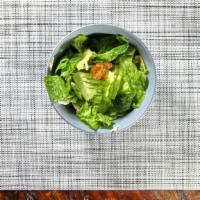 Caesar Salad · Crisp romaine lettuce with Caesar dressing and croutons.