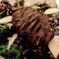Grilled Steak Salad · Grilled sirloin steak, served on a bed of greens, topped with tomatoes, roasted red peppers,...
