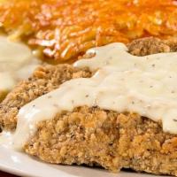 2 Eggs & Country Fried Steak · Country Fried Steak served with 2 Farm-Fresh eggs* cooked to order, homestyle grits or crisp...