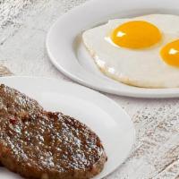 2 Eggs & Country Sausage · Country sausage served with 2 Farm-Fresh eggs* cooked to order, homestyle grits or crispy ha...