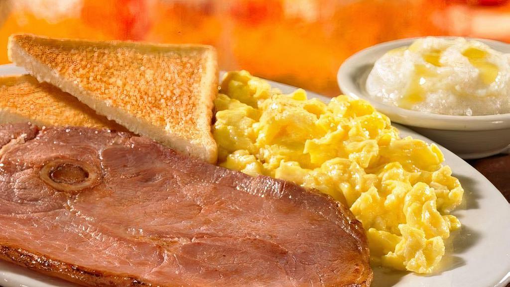 2 Eggs & Country Ham · Served with 2 Farm-Fresh eggs* cooked to order, homestyle grits or crispy hashbrowns or seasonal fruit, and buttery toast or biscuit (Cal 985-1180)