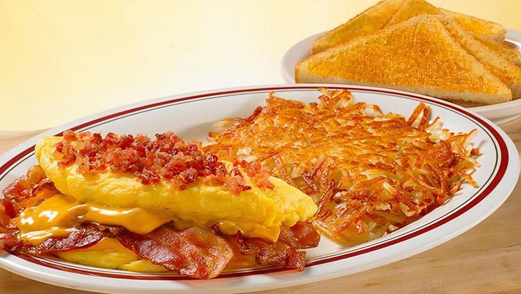 Omelet-Mega Bacon Cheese · Applewood smoked bacon and American cheese topped with sizzlin’ chopped bacon bits. served with your choice of homestyle grits or crispy hashbrowns or seasonal fruit, and buttery toast or biscuit. (Cal 925-1120)