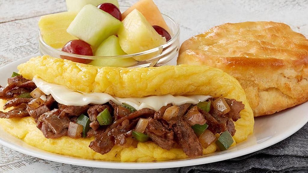 Omelet-Philly Cheesesteak · Thinly sliced steak, Swiss cheese, diced onions and green bell peppers served with your choice of homestyle grits or crispy hashbrowns or seasonal fruit, and buttery toast or biscuit (Cal 785-980)