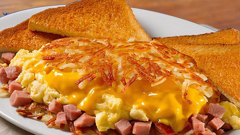 Ham & Cheese · Ham, scrambled eggs* and American cheese stuffed between layers of our crispy hashbrowns. Served with buttery toast or biscuit.