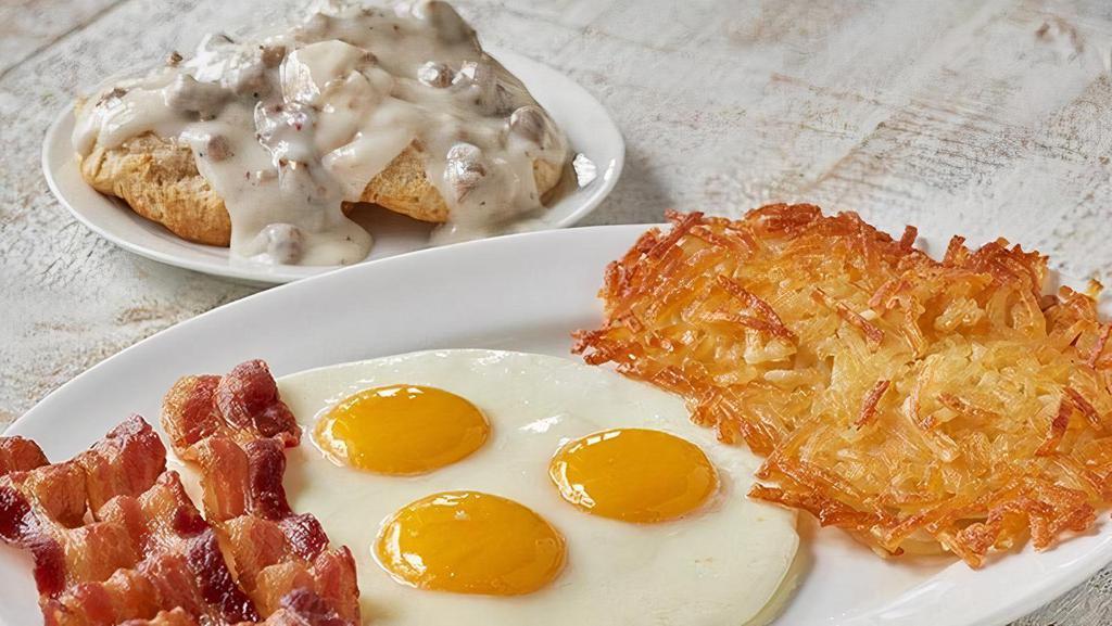 Big House Breakfast · Three Farm-Fresh Eggs, Crispy Hashbrowns or Seasonal Fruit, Biscuit and Sausage Gravy OR Homestyle Grits and Buttery Toast or Biscuit along with choice of Applewood smoked bacon (3 strips) or country sausage or turkey sausage (2 patties) (Cal 815-1010)