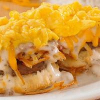 Southern Smothered Biscuit Platter W/ Country Or Turkey Sausage · An open-faced biscuit, crispy hashbrowns, gravy, cheddar cheese and 2 scrambled eggs* with y...