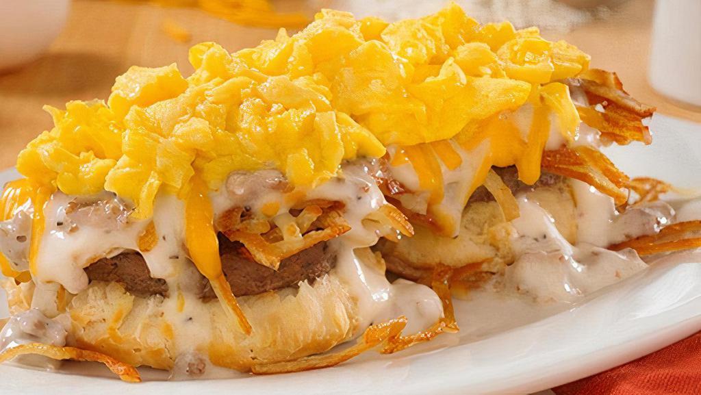 Southern Smothered Biscuit Platter W/ Country Or Turkey Sausage · An open-faced biscuit, crispy hashbrowns, gravy, cheddar cheese and 2 scrambled eggs* with your choice of country sausage or turkey sausage and country sausage gravy (Cal 940-1030)