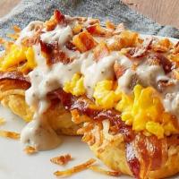 Southern Smothered Biscuit Platter W/ Bacon · An open-faced biscuit, crispy hashbrowns, gravy, cheddar cheese and 2 scrambled eggs* topped...