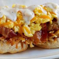 Southern Smothered Biscuit Platter W/ Chicken And Bacon · An open-faced biscuit, crispy hashbrowns, gravy, cheddar cheese and 2 scrambled eggs* served...