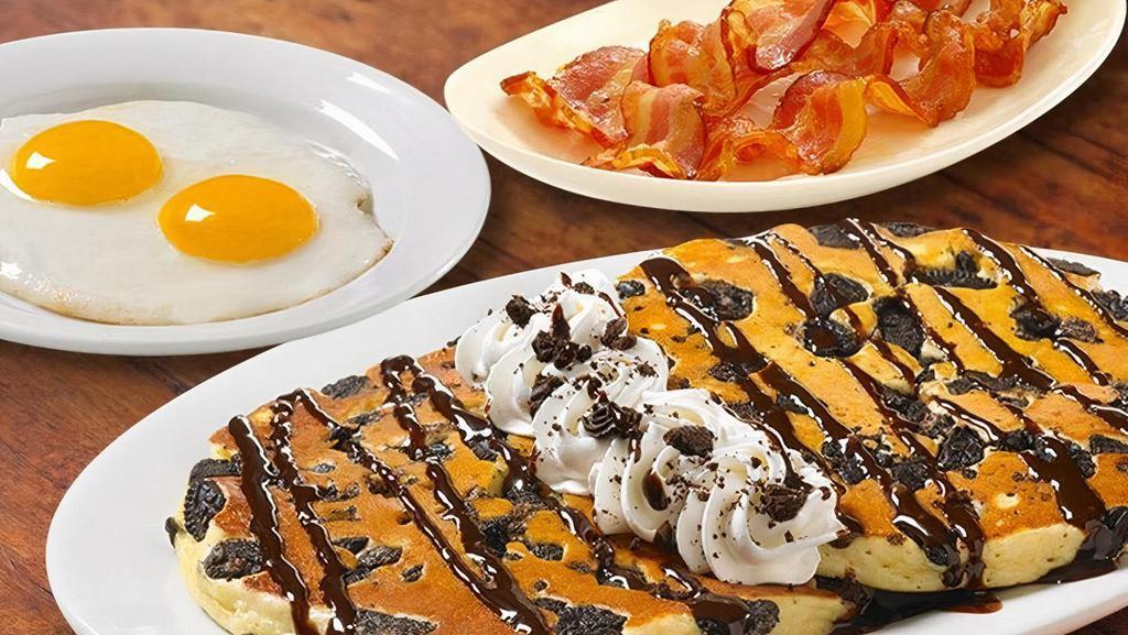 Sweet Cake Platters With Sausage Or Bacon · Pancakes Perfected: Two platter-sized, thick and fluffy pancakes, topped with sweetness plus two Farm-Fresh eggs* cooked to order AND Applewood smoked bacon (3 strips) or country sausage or turkey sausage (2 patties) (Cal 900-1340)