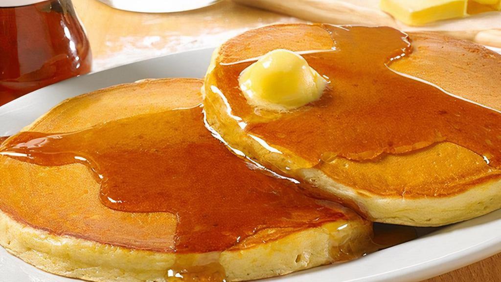 Old-Fashioned Buttermilk Sweet Cakes · Pancakes Perfected: Two platter-sized, thick and fluffy pancakes, topped with sweetness.  The signature pancake (Cal 630)