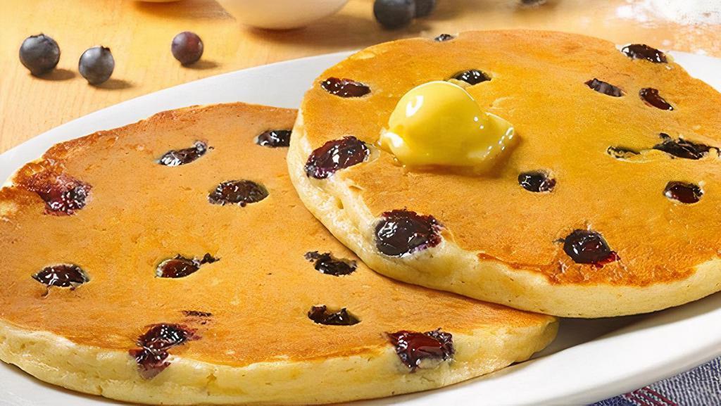 Wild Blueberry Sweet Cakes · Pancakes Perfected: Two platter-sized, thick and fluffy pancakes, topped with sweetness and bursting with plump blueberries (Cal 650)