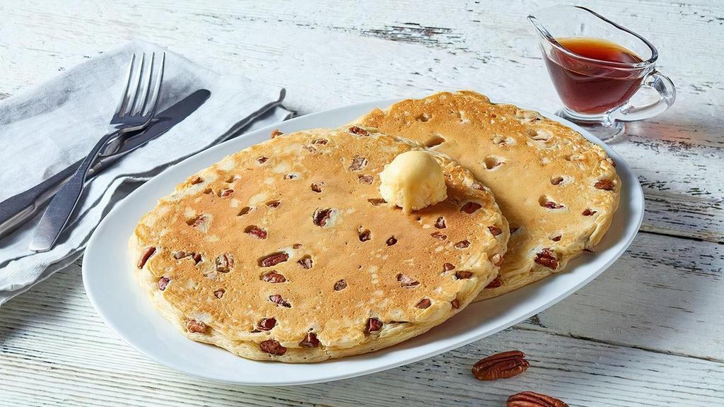 Southern Georgia Pecan Sweet Cakes · Pancakes Perfected: Two platter-sized, thick and fluffy pancakes, topped with sweetness and packed with crunchy pecans (Cal 870)