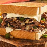 Famous Philly Cheesesteak · Seasoned beefsteak, grilled onions, green bell peppers and melted Swiss cheese on Texas Toas...