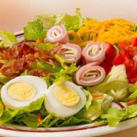Chef Salad · Mixed greens, carrots, red cabbage, tomatoes, chopped bacon, diced ham, sliced turkey, hard ...