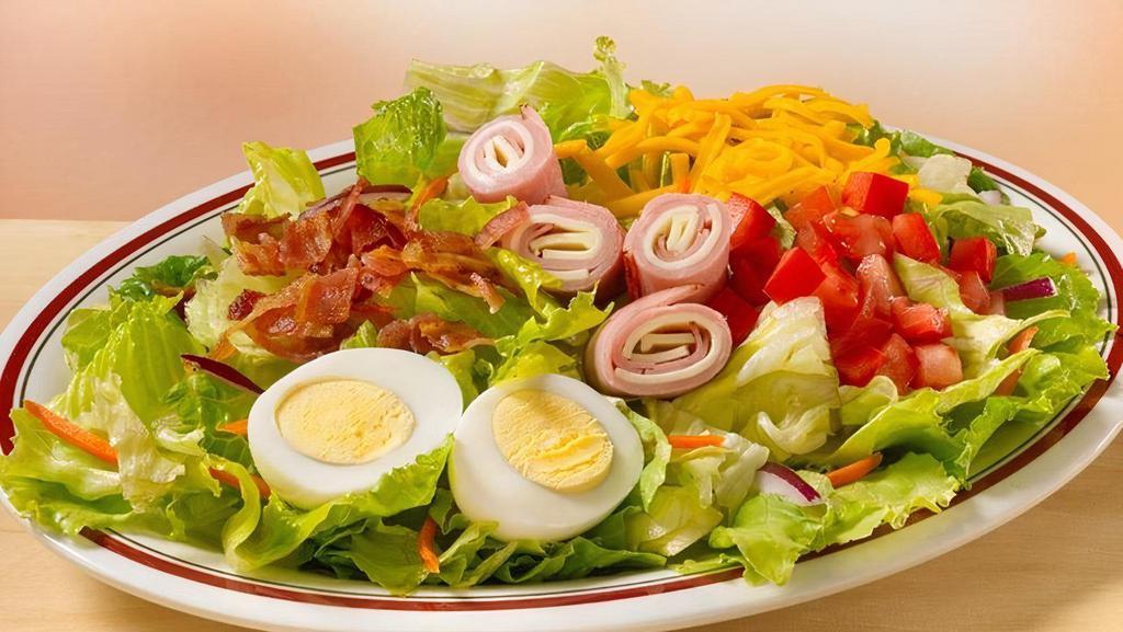 Chef Salad · Mixed greens, carrots, red cabbage, tomatoes, chopped bacon, diced ham, sliced turkey, hard boiled egg, croutons and shredded cheddar cheese. (Cal 380)