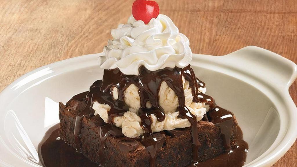 Warm Brownie Ala Mode · Rich, chocolate brownie with vanilla ice cream drizzled with chocolate (Cal 900)