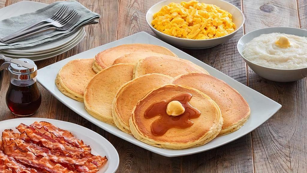 Sweet Cake Family Meal · (8) Platter sized, thick and fluffy buttermilk pancakes and rich syrup served with choice of crispy Applewood smoked bacon or country sausage, farm fresh scrambled eggs, and choice of grits, hashbrowns or crispy tater tots.  Cal: 4200-6240