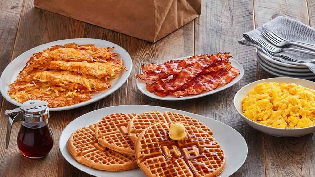 (4) Waffle Family Meal · (4) Golden waffles served with rich syrup and choice of crispy Applewood bacon or country sausage, farm fresh scrambled eggs, and choice of grits, hashbrowns or crispy tater tots.  Cal: 4060-6100