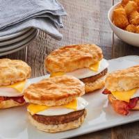Biscuit Sandwich Family Meal · (4) Fluffy biscuits topped with a farm fresh egg, choice of bacon or sausage, and American c...