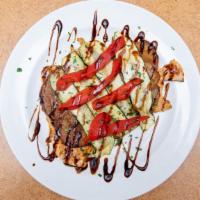 Chicken Stack · Grilled chicken stacked with grilled eggplant, zucchini and roasted red pepper topped with a...