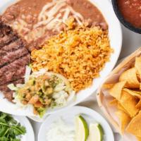 Carne Asada ￼ · Grilled steak served with rice and beans 2 corn or 1 flour tortilla