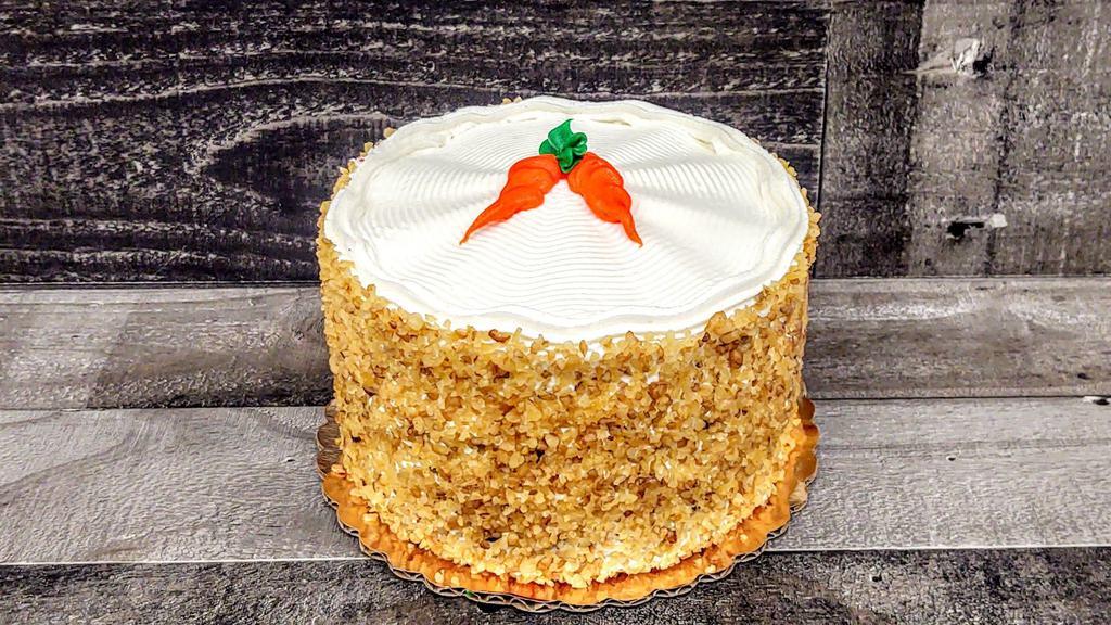 Carrot Cake · Carrot cake walnuts, raisins, coconuts and cream cheese icing.
