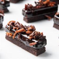 Chocolate Explosion  · Multi-textured chocolate cake comprised of a crunchy chocolate brownie base, high grade 70% ...
