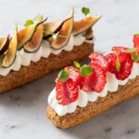 Mixed Berries Eclair · Crunchy choux pastry dough filled with lightly sweetened 100% vanilla cream and mixed berrie...