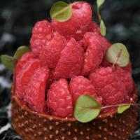 Raspberry Pistachio Tart · Sweet crunchy almond dough tart shell containing a soft pistachio biscuit, mixed-berries ora...
