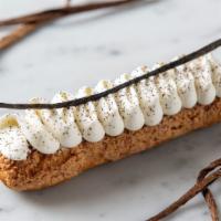 100% Vanilla Eclair · Crunchy choux pastry dough filled with 100% vanilla cream which has been infused with Tahiti...
