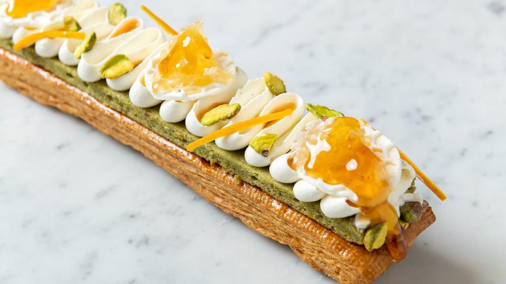 Honey Orange Blossom Pistachio Mille Feuille (Serves 2) · Crunchy puff pastry with whipped honey, soft pistachio biscuit, light orange blossom vanilla chantilly, pistachios, and almond dough pieces, topped with fresh honeycomb, sea salt honey, and orange zest