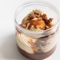 Super Dark Chocolate Crunchy Mousse · 70% dark chocolate mousse from Valrhona with dulce de leche chantilly, a mix of crunchy toas...