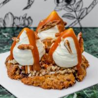 Caramel Dulce De Leche Cookie · Salted chocolate chip cookie topped with dulce de leche chantilly, a toasted mix of nuts, sa...