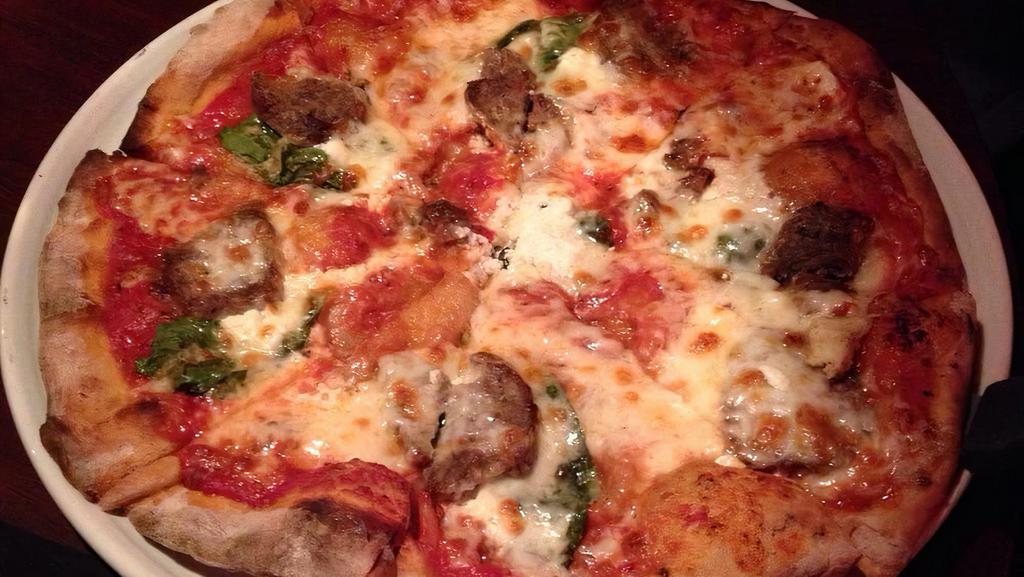 Polpette · Classic red sauce, sliced meatballs, fresh Basil, ricotta and napa cheese blend.