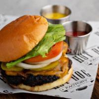 Factory Burger · 1/2 pound of 100% Angus beef with lettuce, tomato, onions, and pickles on request