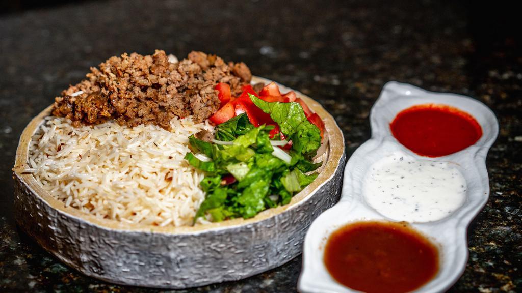 Gyro Over Rice Platter - Halal · Served with Gyro, Rice, Lettuce, and Tomatoes along with your Favorite Toppings and White and Hot Sauce. 

Ingredients: Beef, Rice, Lettuce, Tomatoes, Cucumbers and Yogurt. All our products are Halal.